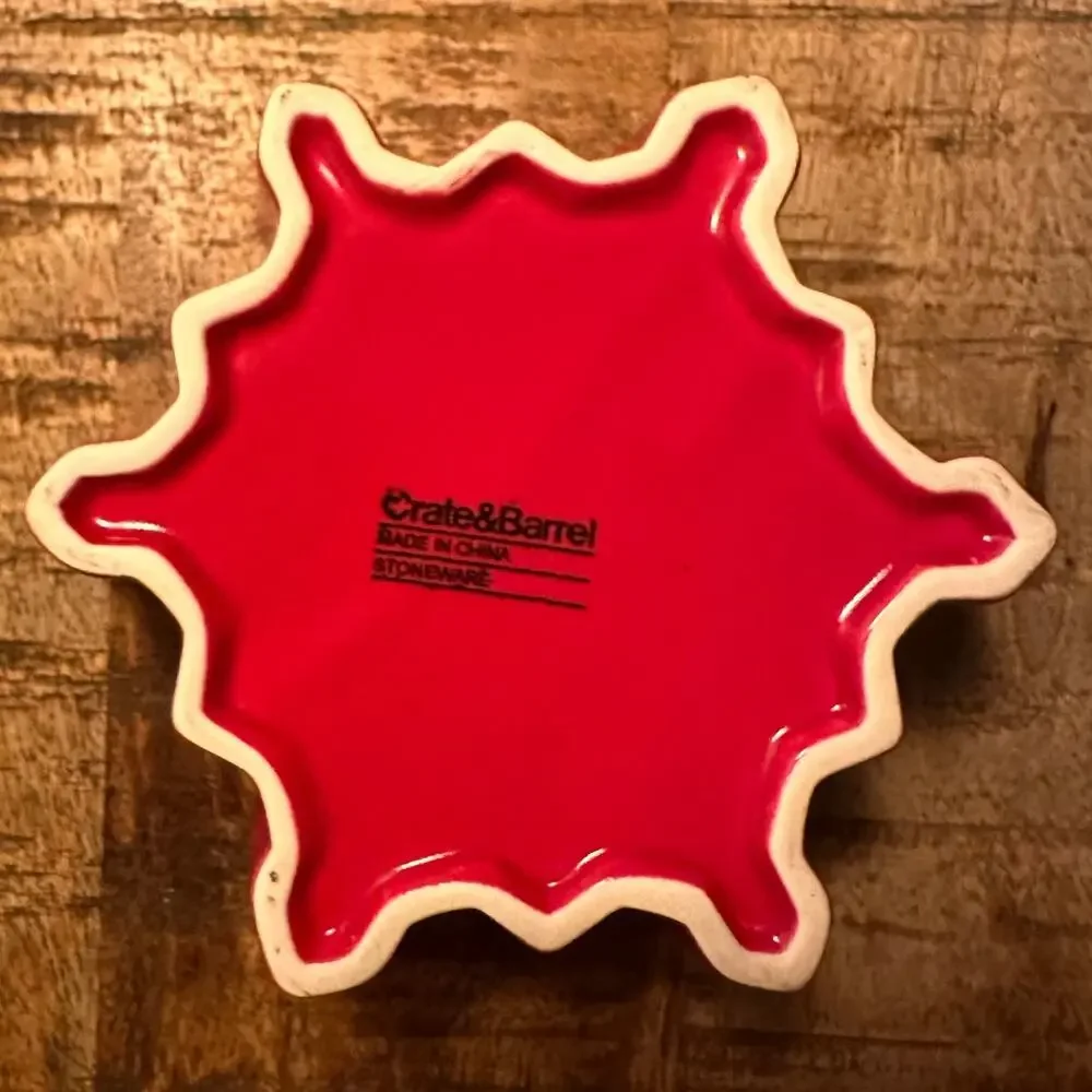 Crate & Barrel pair of red and white ceramic snowflake shaped bowls
